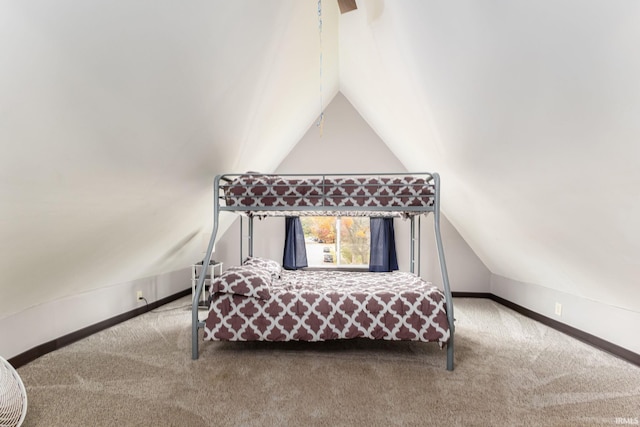 1026 N Michigan St, South Bend, IN 46617 - carpeted bedroom with lofted ceiling and baseboards