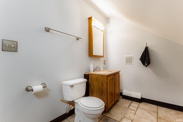 1026 N Michigan St, South Bend, IN 46617 - bathroom with toilet, vanity, and baseboards