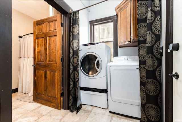 1026 N Michigan St, South Bend, IN 46617 - washroom featuring washer and clothes dryer and cabinet space
