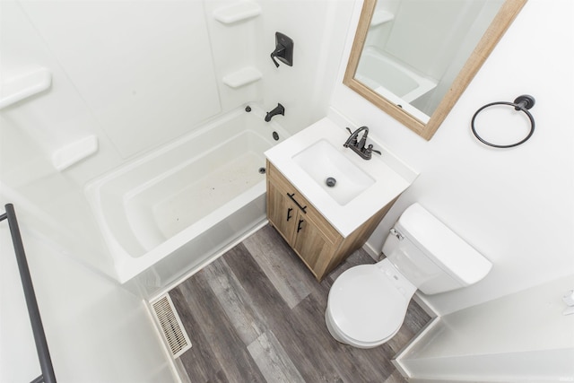 full bath with wood finished floors, vanity, and toilet