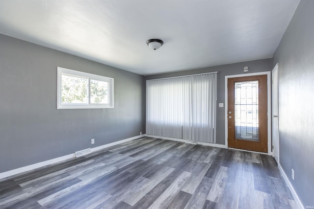entryway featuring dark wood-style flooring and baseboards