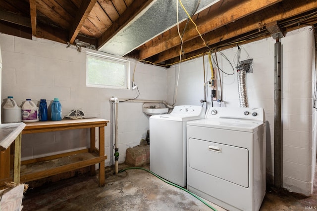 laundry area featuring washing machine and clothes dryer