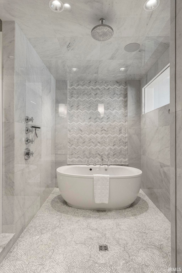 202 W Berry St Unit 810, Fort Wayne, IN 46802 - full bath featuring a tile shower, a soaking tub, tile walls, and recessed lighting