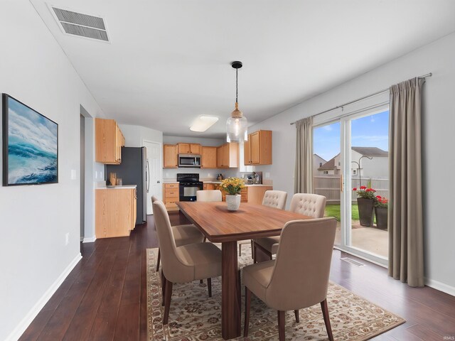 11515 Ballycastle Pl, Fort Wayne, IN 46818 - dining room with dark wood-style flooring and baseboards