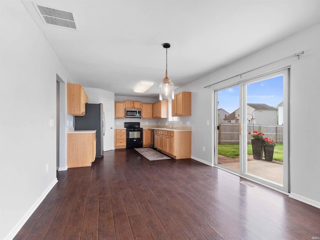 11515 Ballycastle Pl, Fort Wayne, IN 46818 - kitchen featuring stainless steel appliances, dark wood-style floors, baseboards, and light countertops