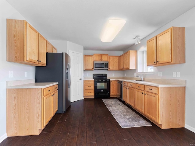 11515 Ballycastle Pl, Fort Wayne, IN 46818 - kitchen featuring appliances with stainless steel finishes, dark wood-type flooring, a sink, and light countertops