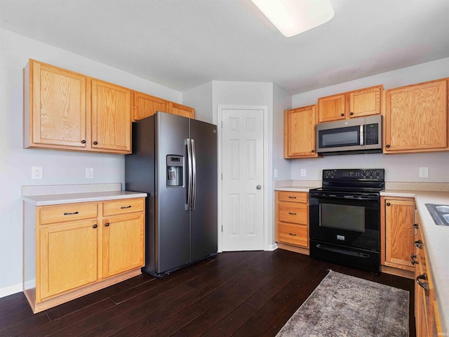 11515 Ballycastle Pl, Fort Wayne, IN 46818 - kitchen featuring stainless steel appliances, dark wood finished floors, and light countertops