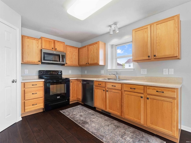 11515 Ballycastle Pl, Fort Wayne, IN 46818 - kitchen featuring stainless steel microwave, dishwashing machine, black range with electric cooktop, a sink, and dark wood-style flooring