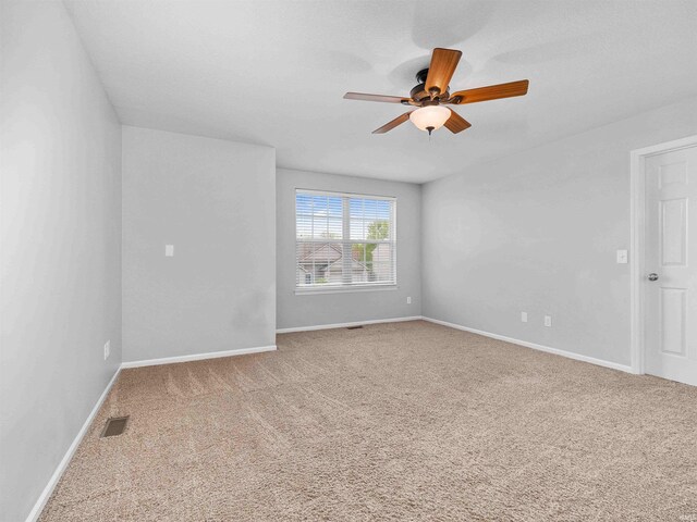 11515 Ballycastle Pl, Fort Wayne, IN 46818 - empty room featuring carpet flooring, ceiling fan, and baseboards