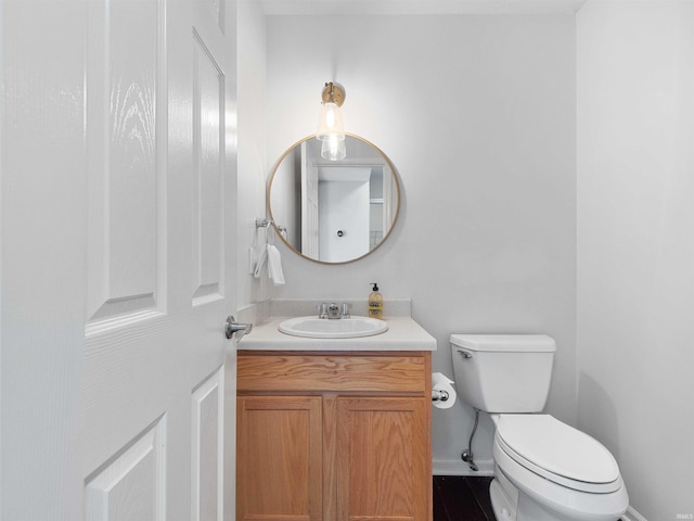 11515 Ballycastle Pl, Fort Wayne, IN 46818 - bathroom with toilet, vanity, and baseboards
