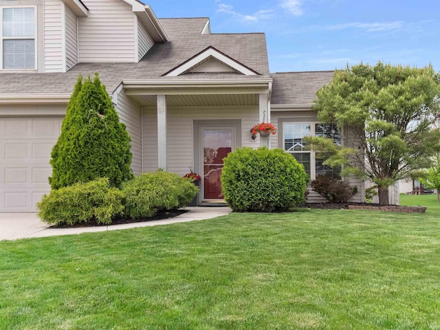 11515 Ballycastle Pl, Fort Wayne, IN 46818 - view of front of property with a garage, a shingled roof, and a front lawn