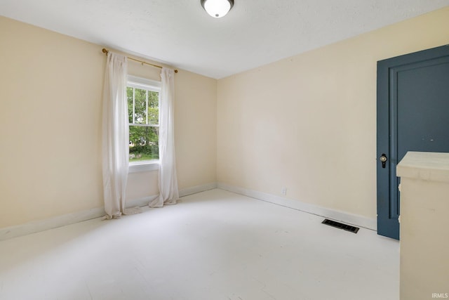 spare room featuring concrete floors