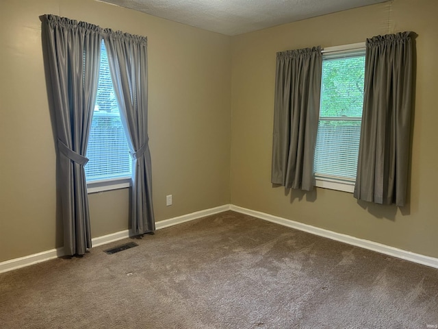 2705 Edgar St, Evansville, IN 47710 - unfurnished room with dark colored carpet and baseboards