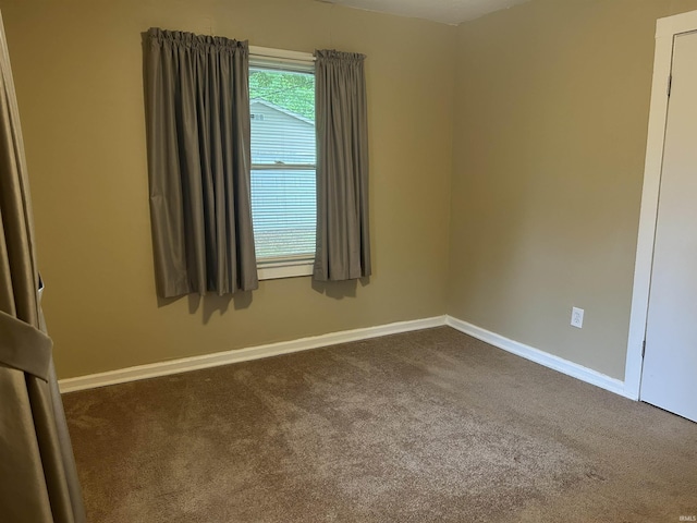 2705 Edgar St, Evansville, IN 47710 - spare room with dark colored carpet and baseboards