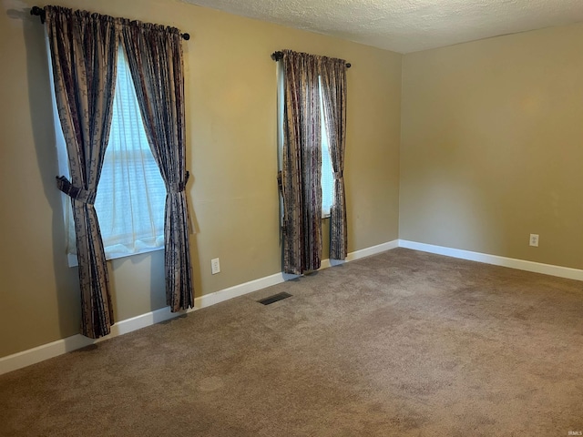 2705 Edgar St, Evansville, IN 47710 - carpeted spare room with baseboards and a textured ceiling