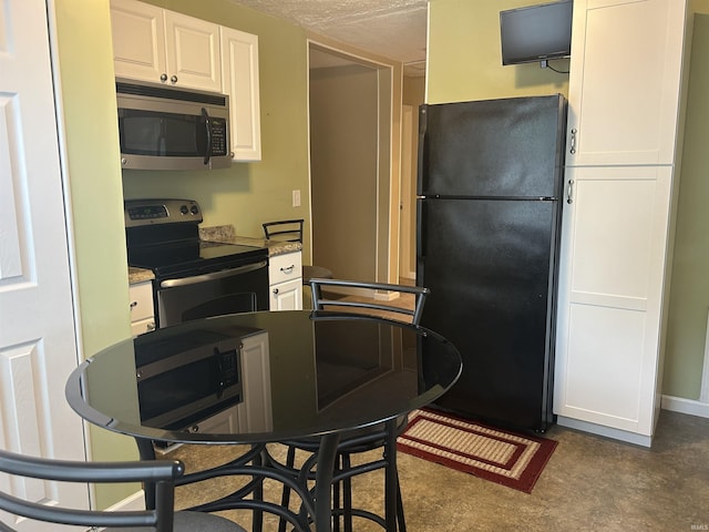 2705 Edgar St, Evansville, IN 47710 - kitchen with appliances with stainless steel finishes and white cabinetry