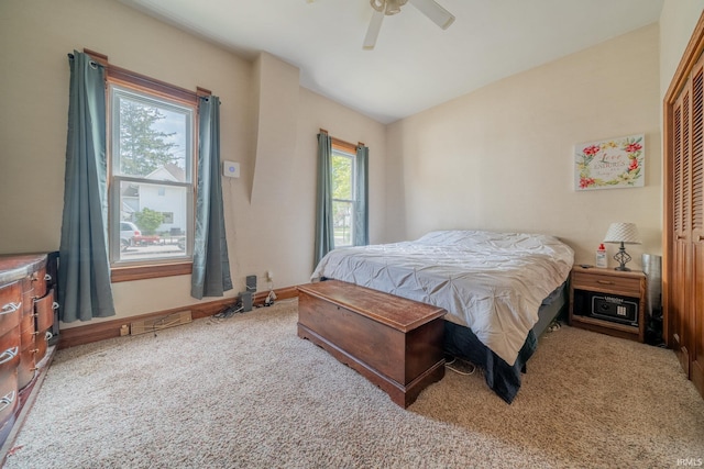 521 S Riverside Dr, Winamac, IN 46996 - carpeted bedroom with a closet, a ceiling fan, and baseboards