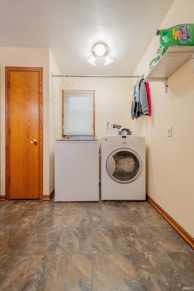 521 S Riverside Dr, Winamac, IN 46996 - washroom with baseboards, stone finish floors, and washer and dryer