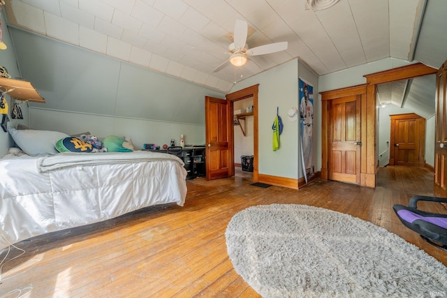 521 S Riverside Dr, Winamac, IN 46996 - bedroom with light wood-type flooring, lofted ceiling, baseboards, and ceiling fan