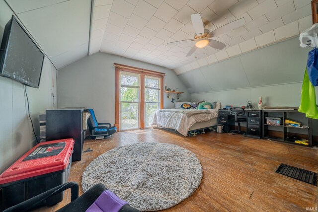 521 S Riverside Dr, Winamac, IN 46996 - bedroom featuring hardwood / wood-style flooring, lofted ceiling, and ceiling fan
