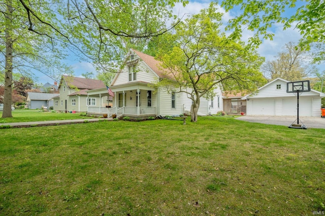 521 S Riverside Dr, Winamac, IN 46996 - view of front of home with covered porch, an outbuilding, and a front yard