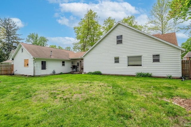 521 S Riverside Dr, Winamac, IN 46996 - rear view of house with a shingled roof