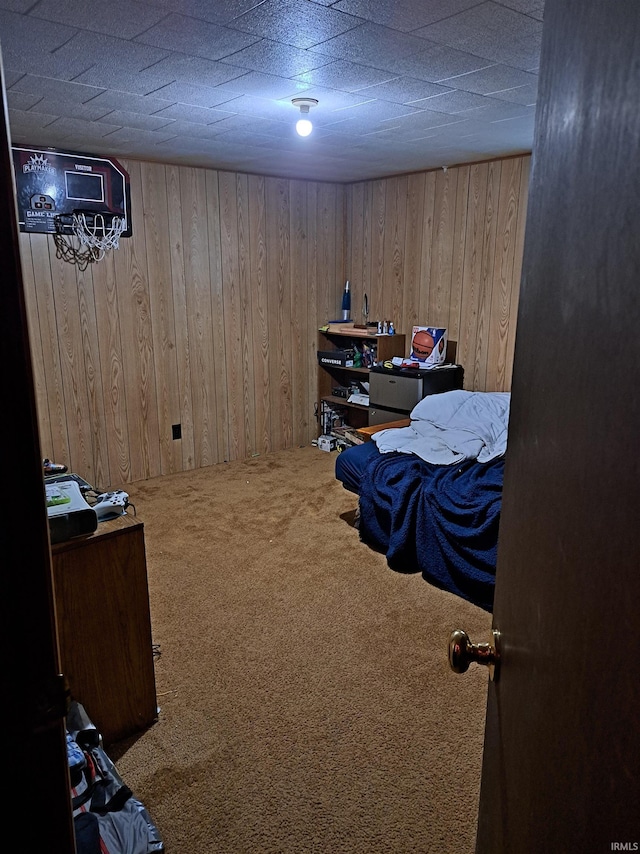 office area with carpet and wood walls