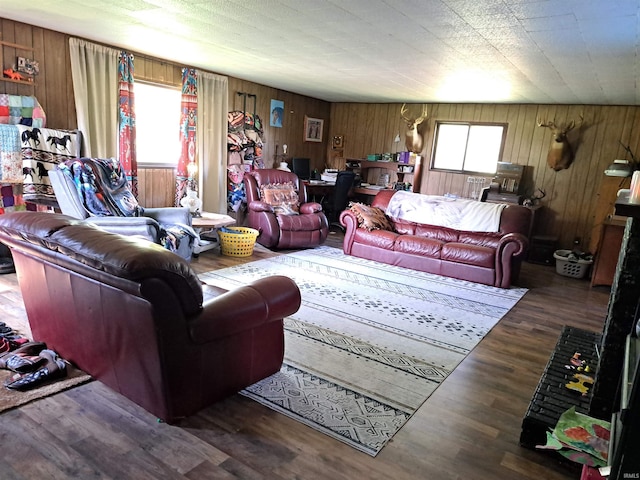 living room with wood walls and wood finished floors