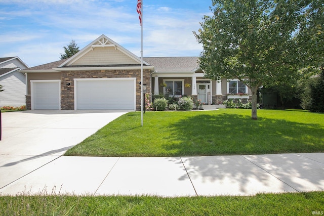 104 Lavender Ct, New Carlisle, IN 46552 - craftsman inspired home featuring an attached garage, concrete driveway, a front yard, and stone siding