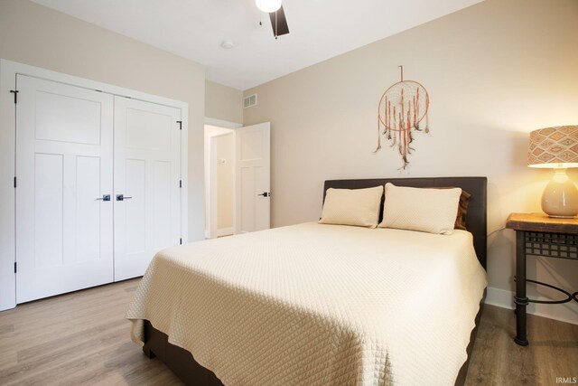 104 Lavender Ct, New Carlisle, IN 46552 - bedroom with wood finished floors, a closet, and a ceiling fan