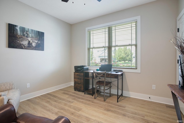104 Lavender Ct, New Carlisle, IN 46552 - office featuring light wood-style floors, a ceiling fan, and baseboards