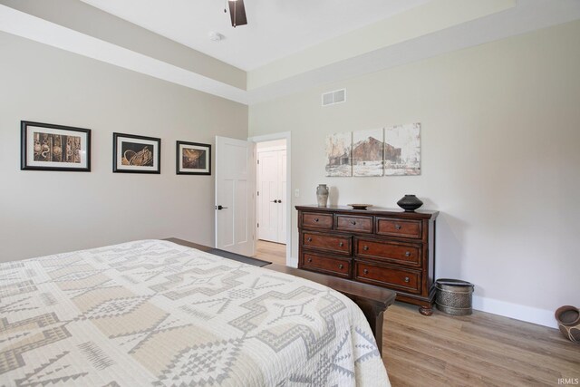 104 Lavender Ct, New Carlisle, IN 46552 - bedroom with baseboards, light wood-type flooring, and a ceiling fan