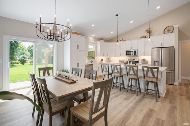104 Lavender Ct, New Carlisle, IN 46552 - dining area featuring a chandelier, recessed lighting, light wood-style flooring, and high vaulted ceiling