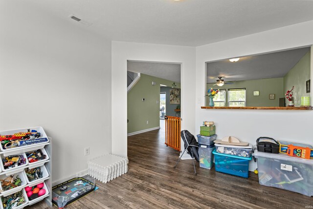 384 Ariel Dr, Kokomo, IN 46901 - rec room with wood finished floors, a ceiling fan, and baseboards