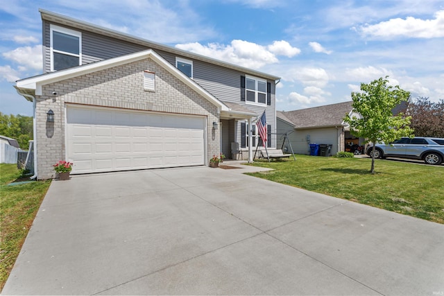 384 Ariel Dr, Kokomo, IN 46901 - traditional-style house featuring a garage, driveway, and a front yard