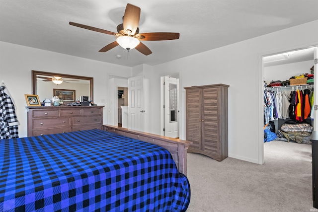 384 Ariel Dr, Kokomo, IN 46901 - bedroom featuring a spacious closet, carpet, ceiling fan, a closet, and baseboards