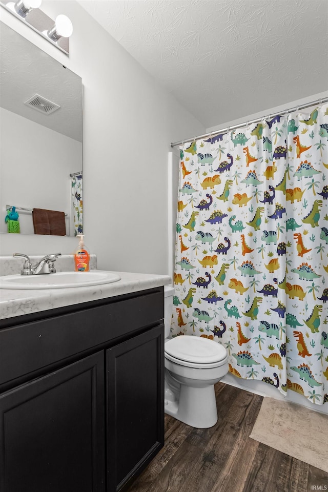 384 Ariel Dr, Kokomo, IN 46901 - bathroom featuring wood finished floors, toilet, and vanity
