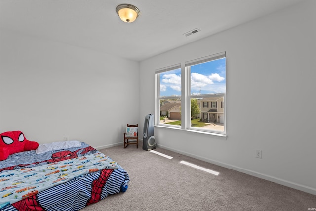 384 Ariel Dr, Kokomo, IN 46901 - bedroom with carpet floors and baseboards