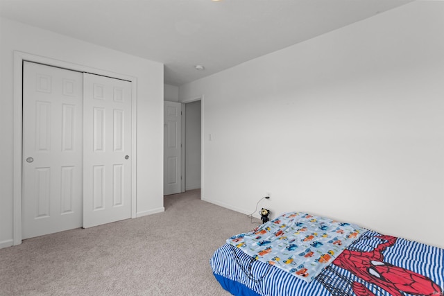 384 Ariel Dr, Kokomo, IN 46901 - carpeted bedroom featuring a closet and baseboards