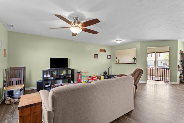 384 Ariel Dr, Kokomo, IN 46901 - living room with dark wood-type flooring, a ceiling fan, and baseboards