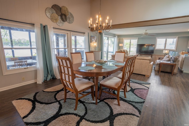 5002 E Oriole Dr, Monticello, IN 47960 - dining area featuring dark wood-type flooring, baseboards, a chandelier, and a ceiling fan