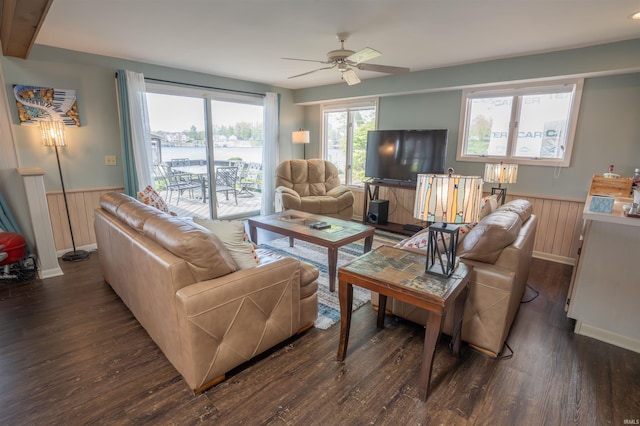 5002 E Oriole Dr, Monticello, IN 47960 - living room featuring wainscoting, a ceiling fan, dark wood-style flooring, wood walls, and baseboards