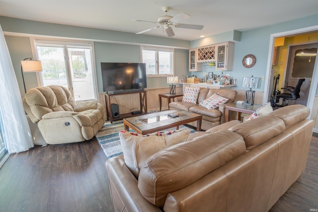 5002 E Oriole Dr, Monticello, IN 47960 - living room featuring dark wood-style flooring, a ceiling fan, and bar