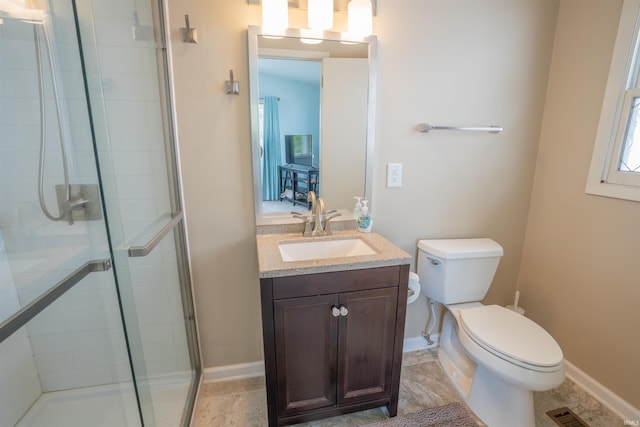5002 E Oriole Dr, Monticello, IN 47960 - full bath with toilet, a shower stall, vanity, and baseboards