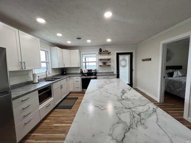 18065 Buzzard Roost Rd, Magnet, IN 47520 - kitchen with appliances with stainless steel finishes, ornamental molding, a sink, a textured ceiling, and light stone counters