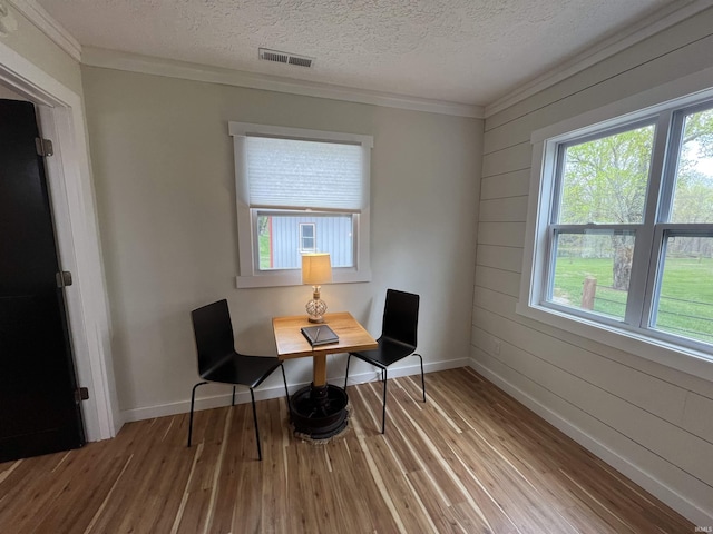 18065 Buzzard Roost Rd, Magnet, IN 47520 - home office with wood finished floors, ornamental molding, baseboards, a textured ceiling, and wooden walls
