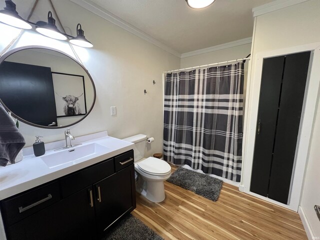 18065 Buzzard Roost Rd, Magnet, IN 47520 - bathroom with wood finished floors, crown molding, vanity, toilet, and a shower with shower curtain