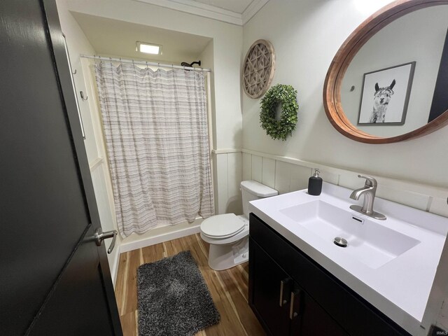 18065 Buzzard Roost Rd, Magnet, IN 47520 - bathroom with wood finished floors, wainscoting, toilet, vanity, and ornamental molding