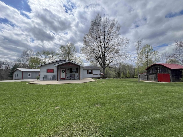 18065 Buzzard Roost Rd, Magnet, IN 47520 - view of grassy yard featuring an outbuilding