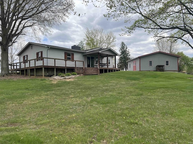 18065 Buzzard Roost Rd, Magnet, IN 47520 - rear view of property with a lawn, a chimney, and a wooden deck